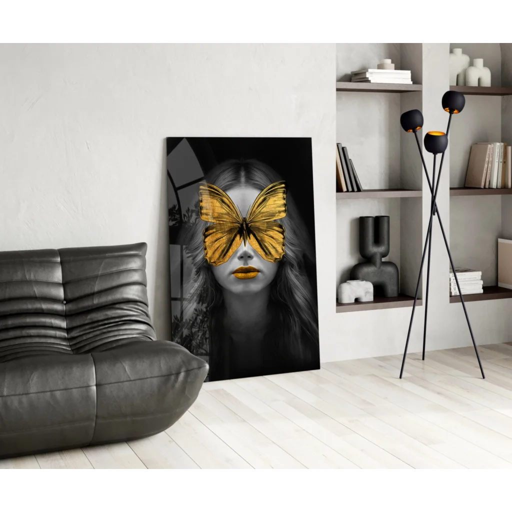Striking black-and-white wall art print of woman with golden butterfly wings over eyes