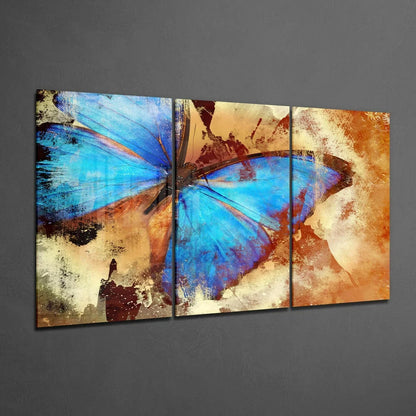 Vibrant blue butterfly glass wall art triptych on textured panels