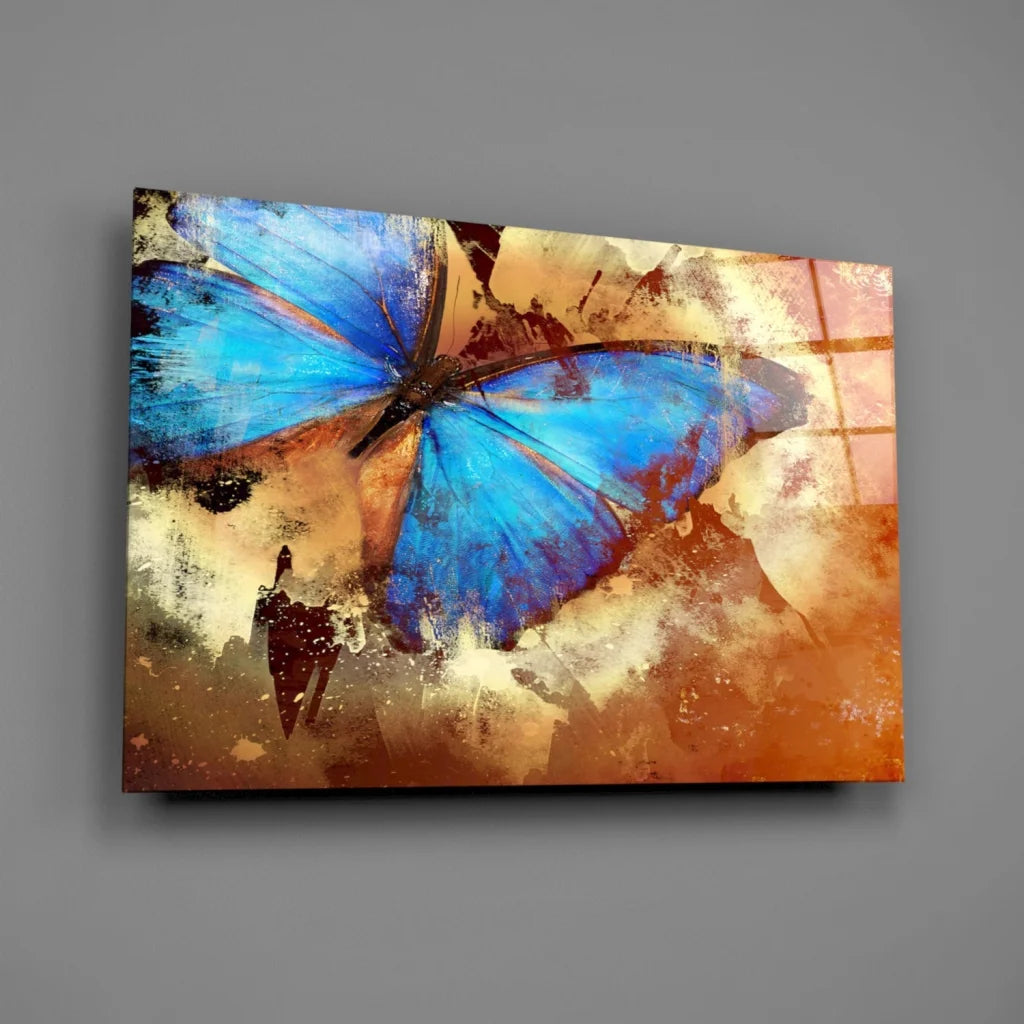Stunning blue butterfly glass wall art on textured earth tones