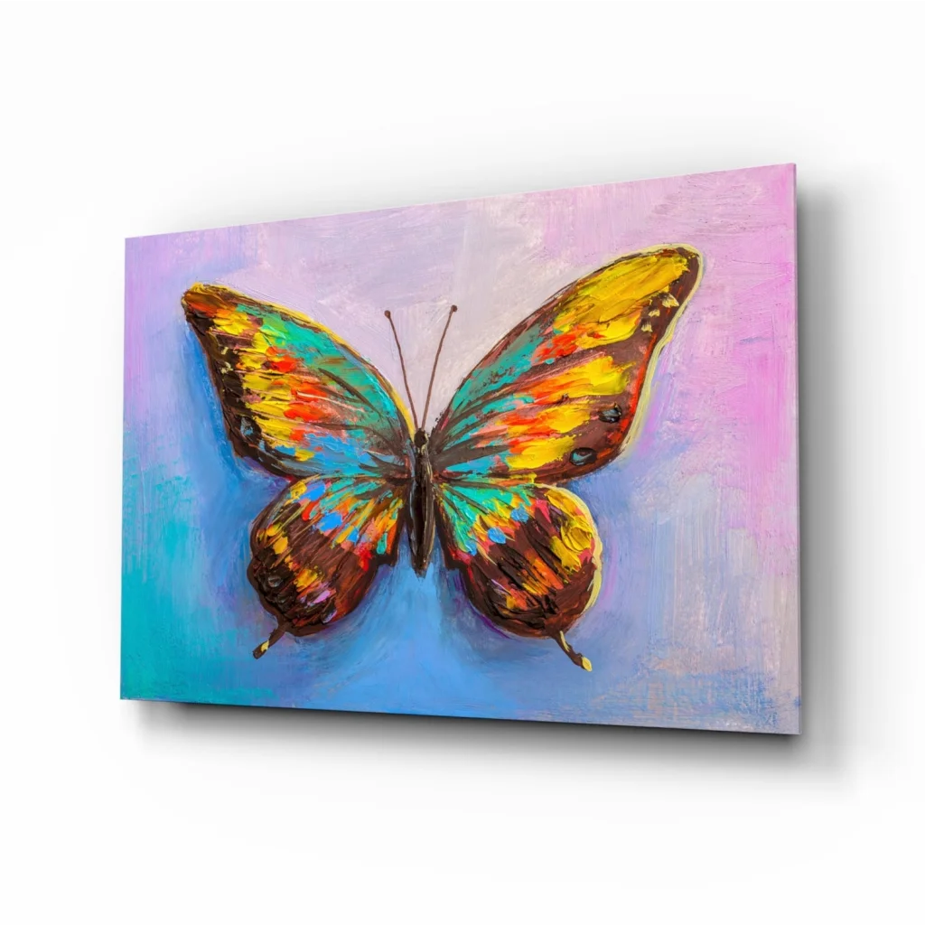 Vibrant butterfly glass wall art with bold yellow teal brown wings on pink blue gradient