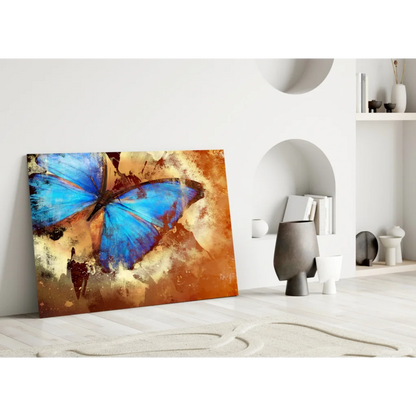 Vibrant blue butterfly glass wall art with textured earthy orange tones