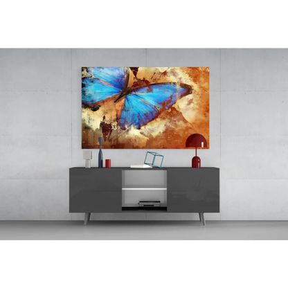 Stunning blue butterfly glass wall art with textured earth tones