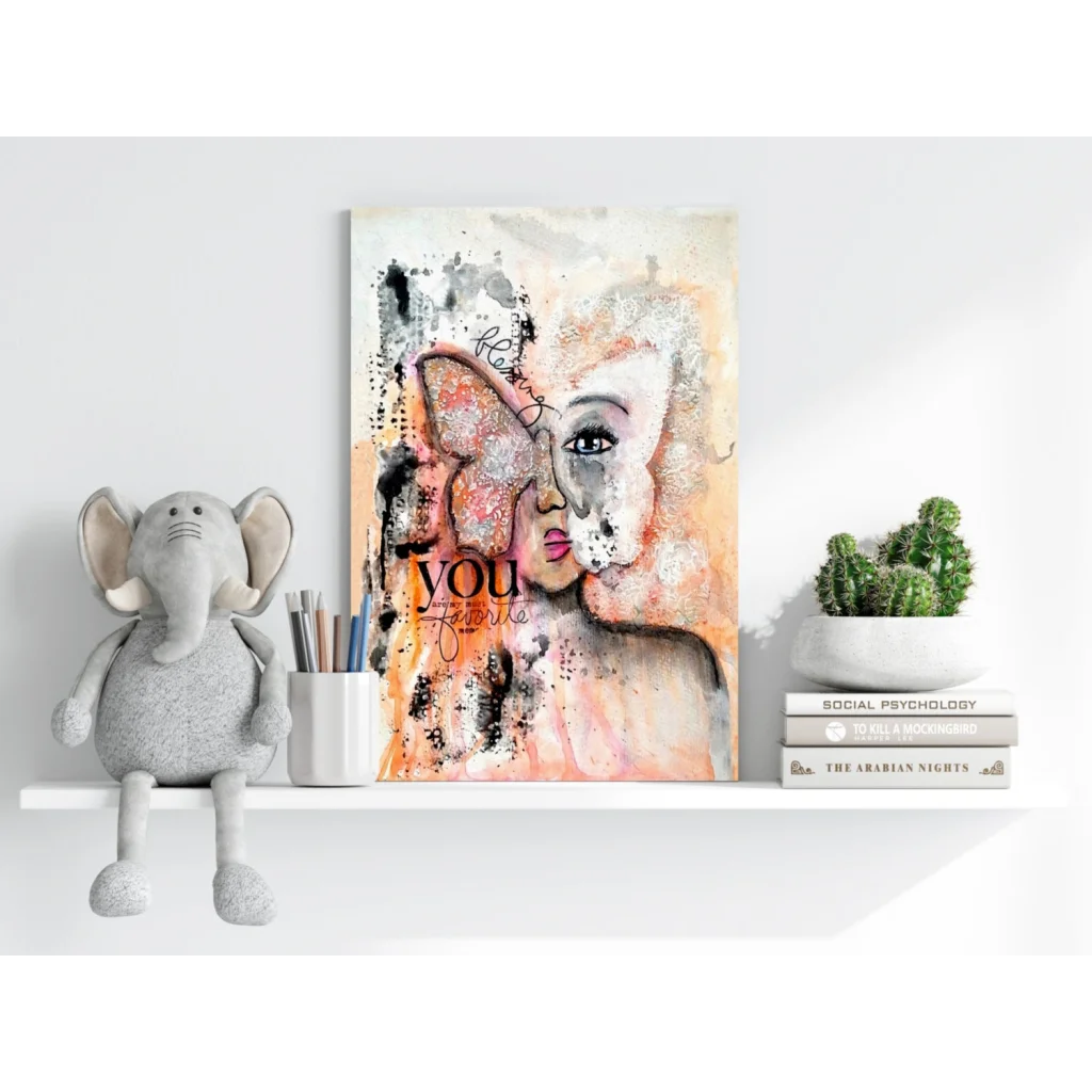 Elephant plush toy with gray fur and big ears on white shelf