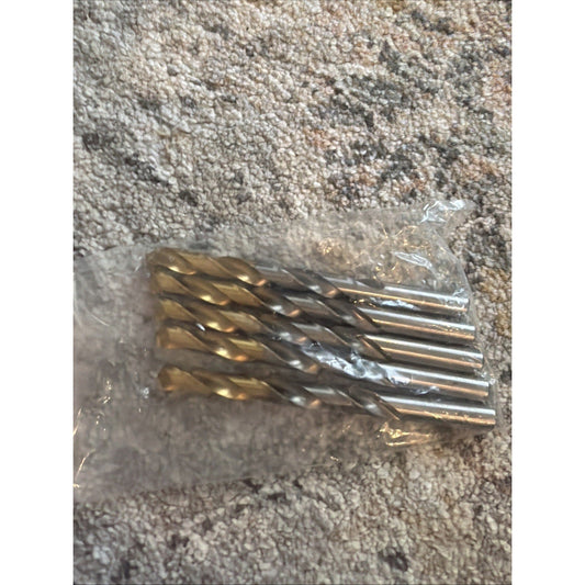 Five gold-coated HSS end mills in clear plastic packaging on a concrete surface, top-down view.