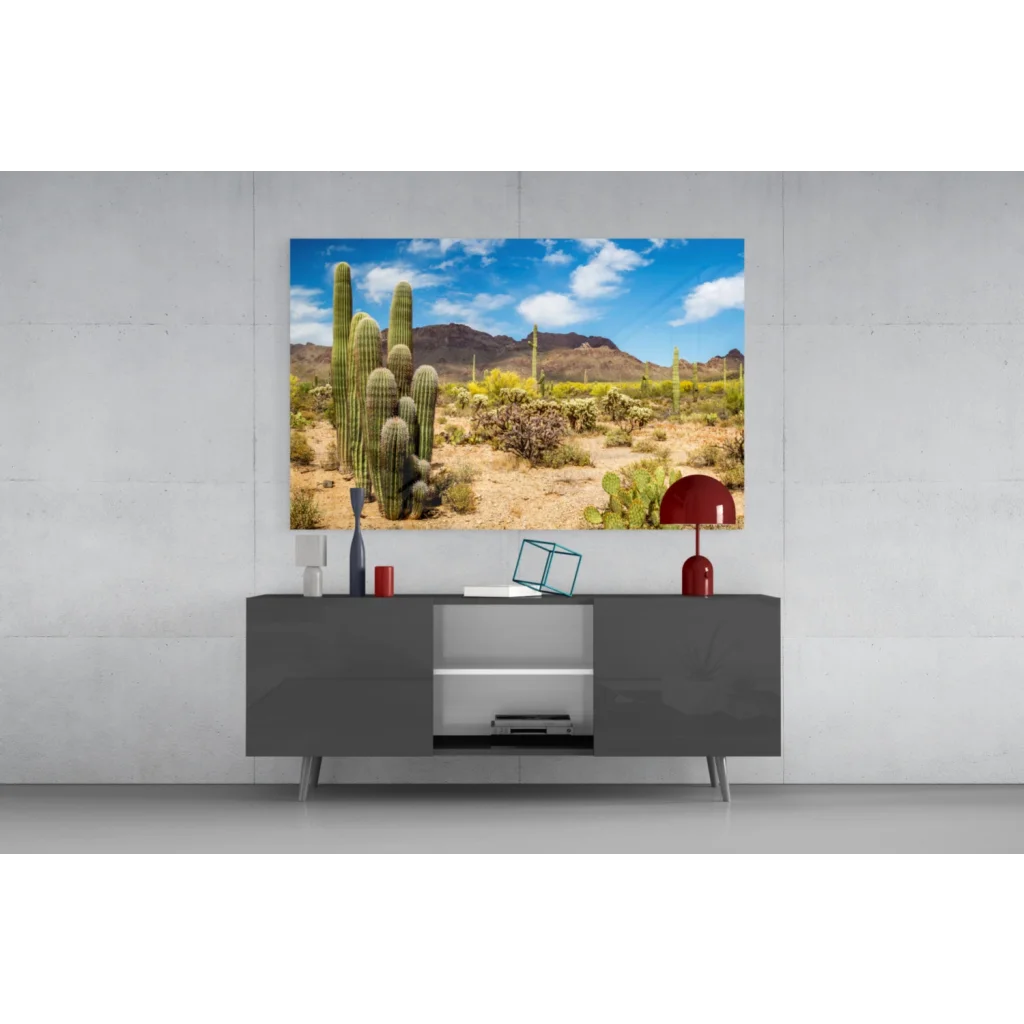 Vibrant desert glass wall art with cacti and mountains under blue sky