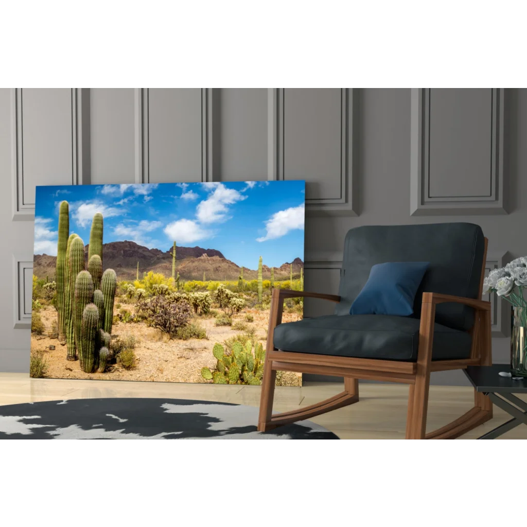 Vibrant desert glass wall art with cacti, mountains, and blue sky