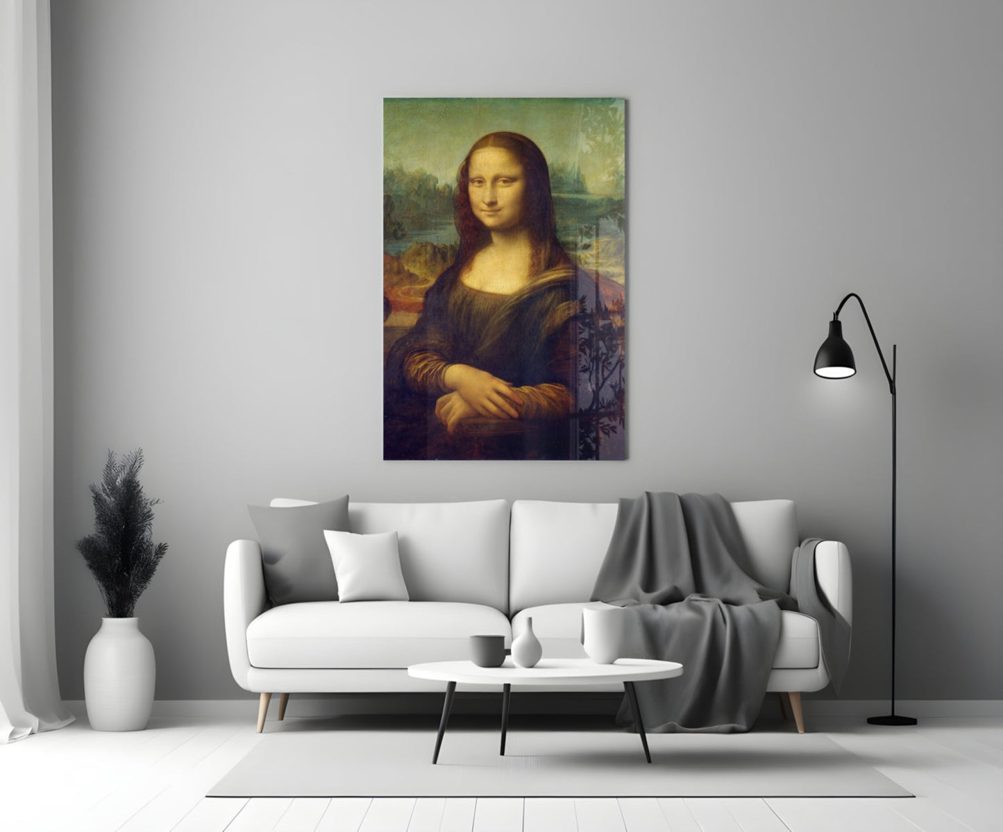 Mona Lisa glass wall art displayed above a white sofa in a modern living room with minimalist décor.