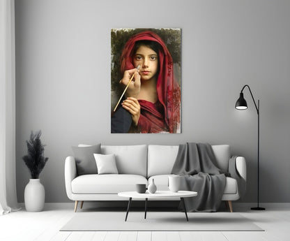 Portrait glass wall art depicting a young woman in red fabric holding a paintbrush, displayed above a modern white sofa.