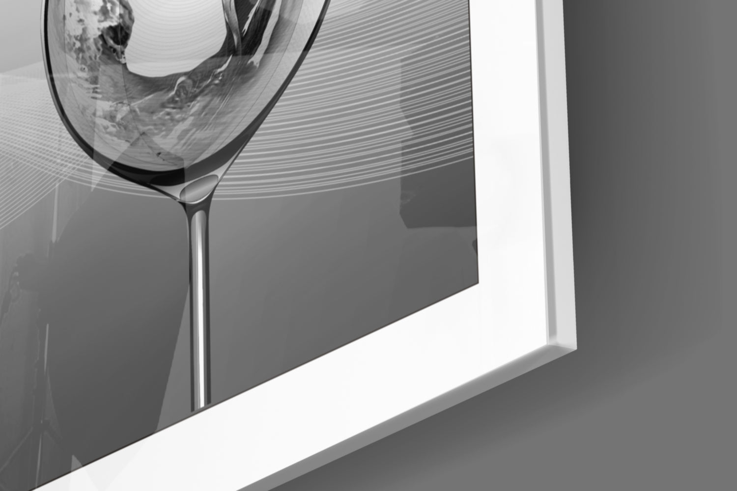 Close-up angled view of a clear glass goblet with etched horizontal line patterns mounted on a white wall frame against gray background.