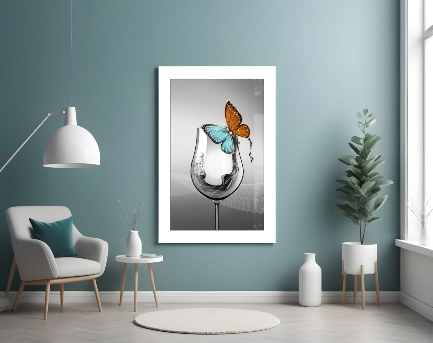 Framed white-matted art print featuring water splashing from a goblet with orange and blue butterflies, displayed on teal wall.