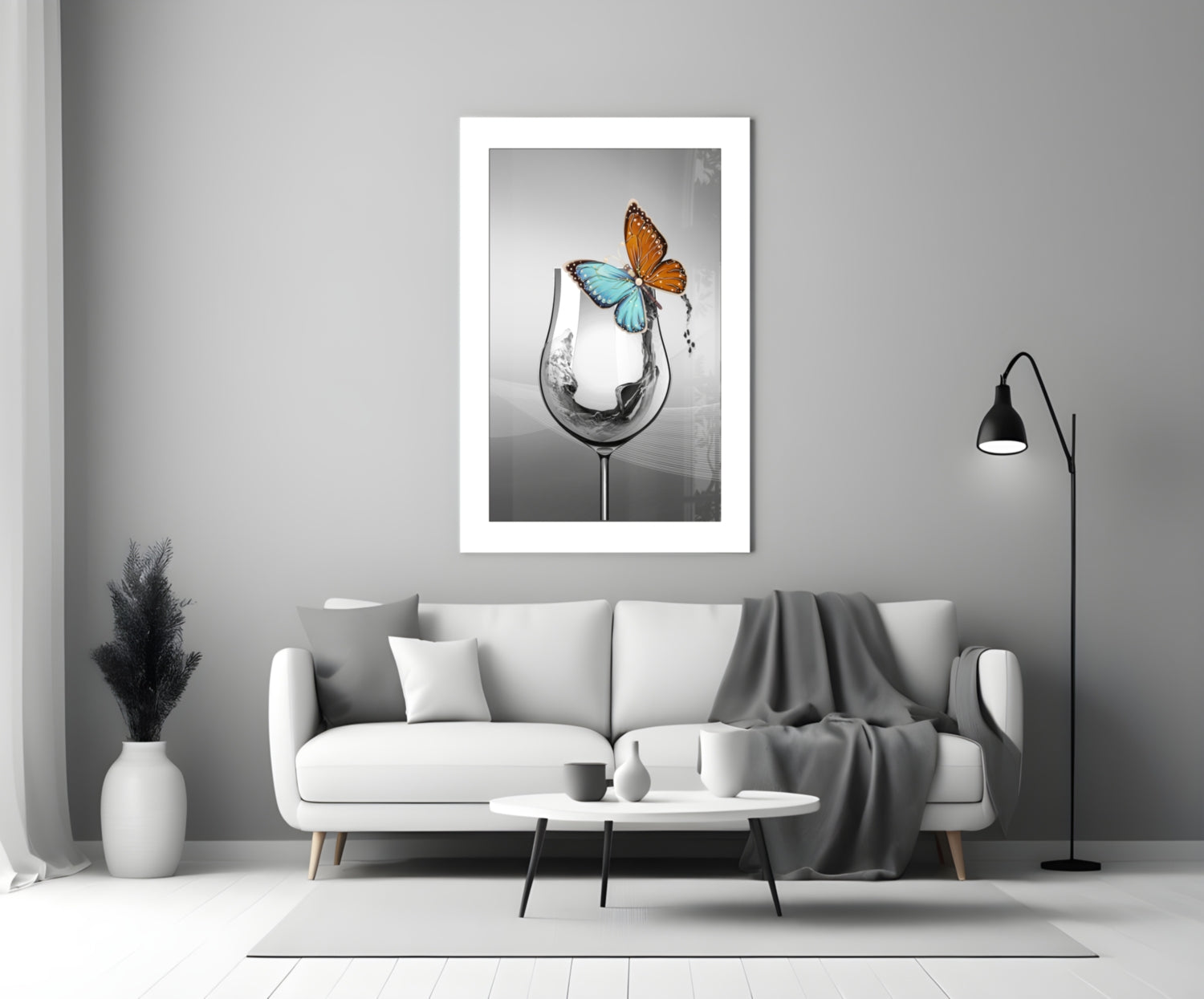 Framed wall art print showing a wine glass with splashing water in black and white, topped with colorful orange and blue butterflies.