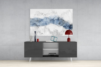 Blue Fog Glass Wall Art displayed above a dark gray media console with white legs, styled with red decorative objects and accessories.