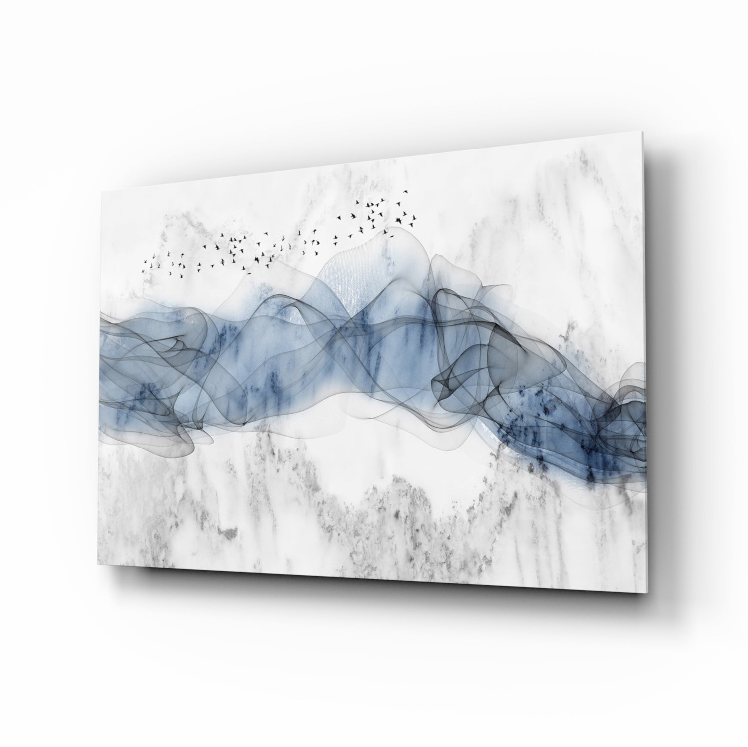 Angled product view of blue fog glass wall art showing translucent layered blue forms with birds and textured gray background on white surface.