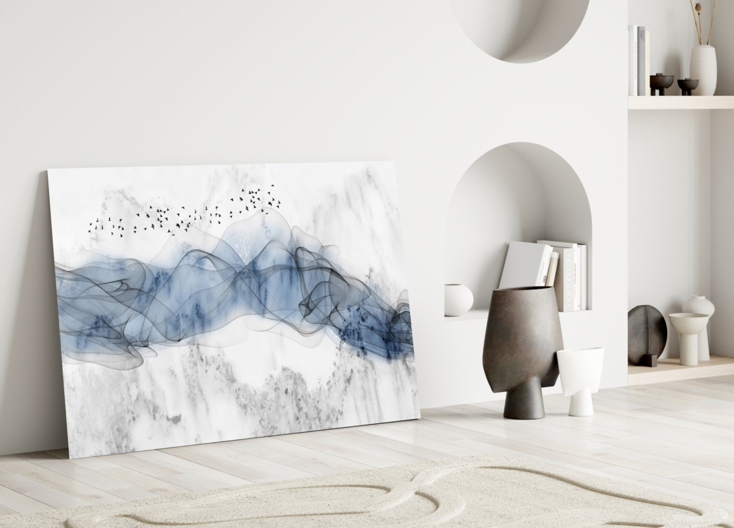 Blue Fog Glass Wall Art leaning against white wall in minimalist room with sand, ceramics, and built-in shelving.