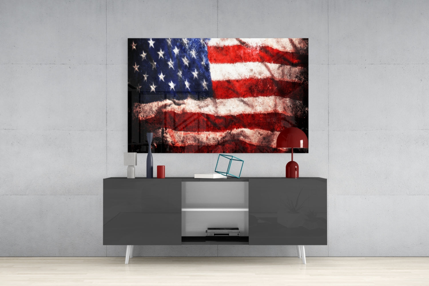 Distressed American flag glass wall art displayed above gray media console in modern living room setting.