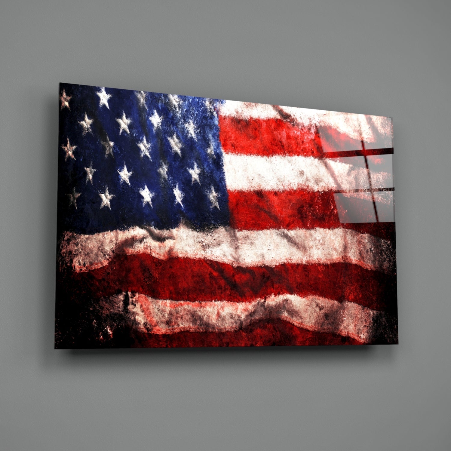 Angled view of distressed American flag glass wall art with white stars, red and white stripes, and shadow overlay on gray background.