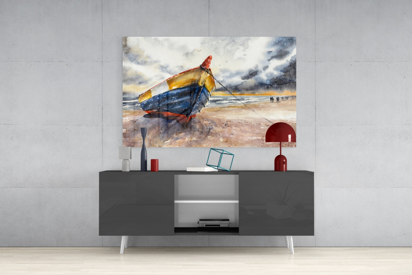 Colorful beached fishing boat glass wall art displayed above a dark gray media console with red and white decorative accessories.
