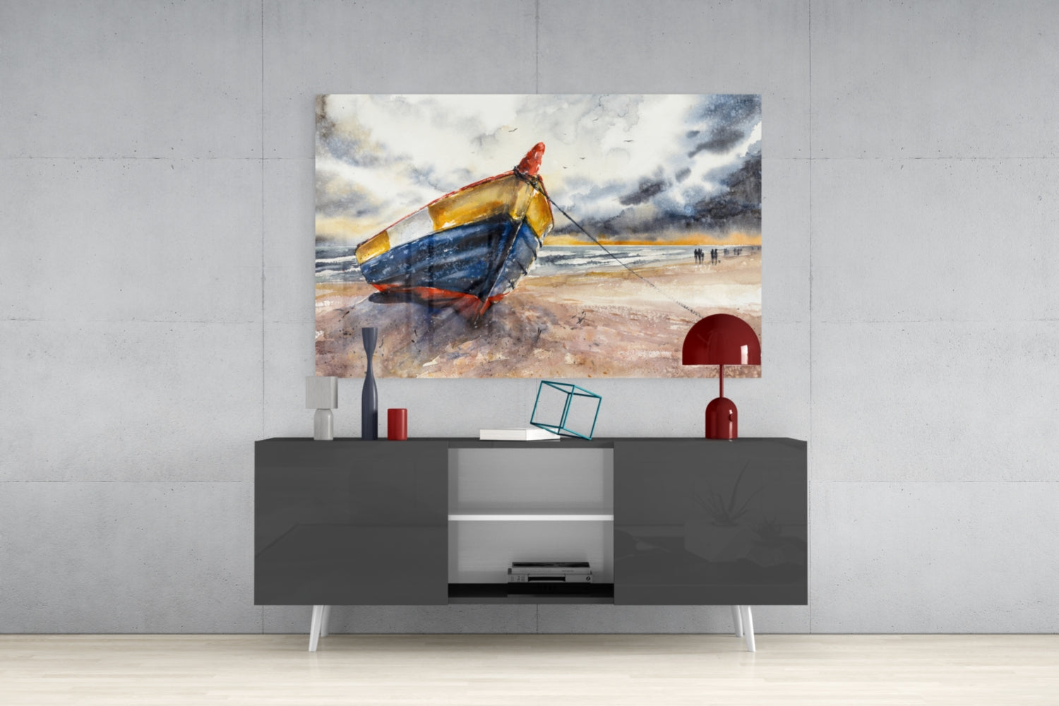 Colorful beached fishing boat glass wall art displayed above a dark gray media console with red and white decorative accessories.