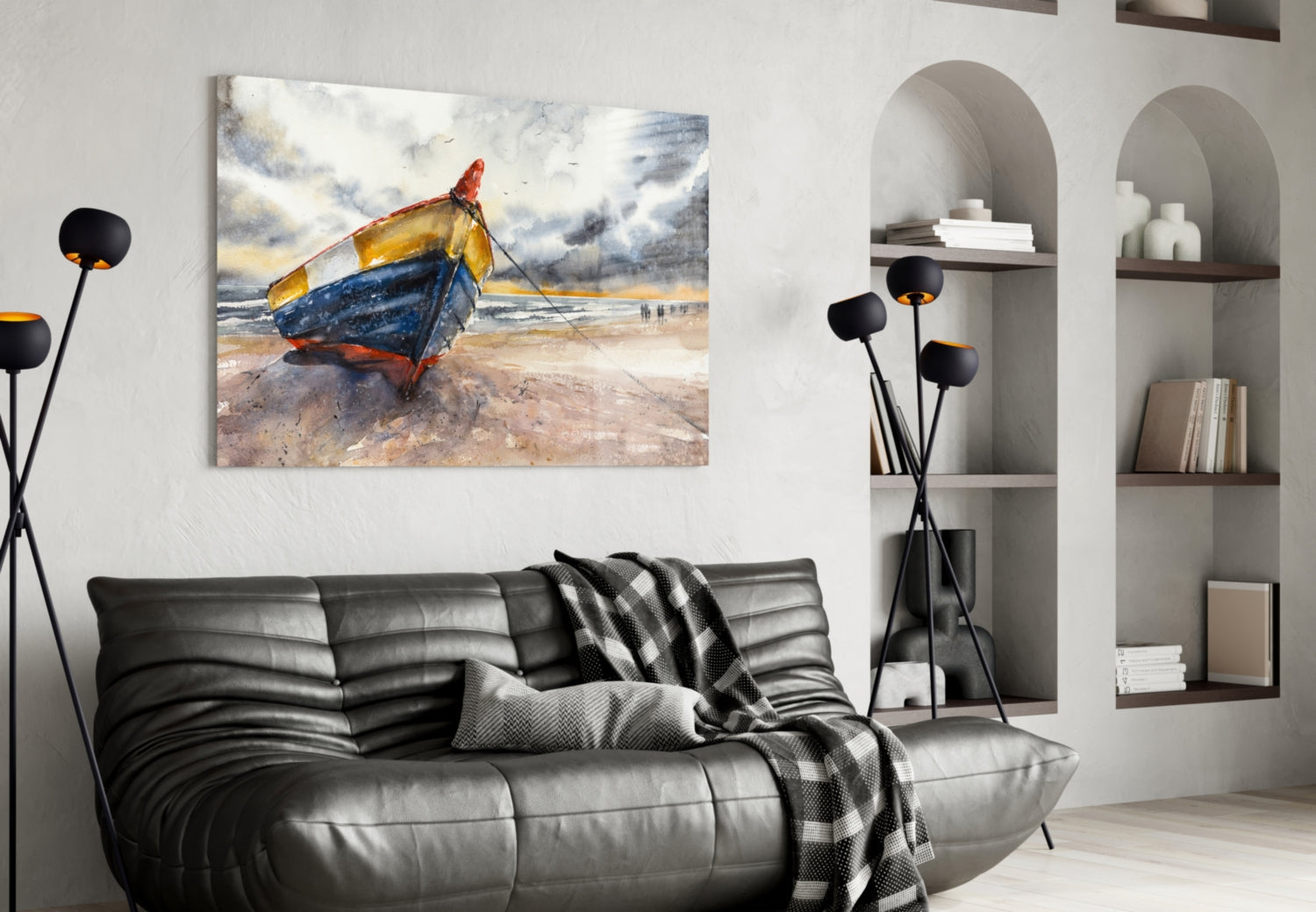 Colorful glass wall art depicting a blue, yellow, and red fishing boat on a beach, displayed above a black leather sofa in a modern living room interior.