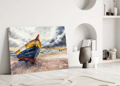 Solo Canoe Glass Wall Art leaning against white wall displaying colorful fishing boat on beach with stormy sky, displayed in minimalist interior setting.