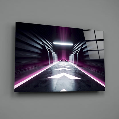 Framed glass wall art displaying a symmetrical futuristic corridor with magenta neon lighting and concrete flooring, mounted on gray wall.