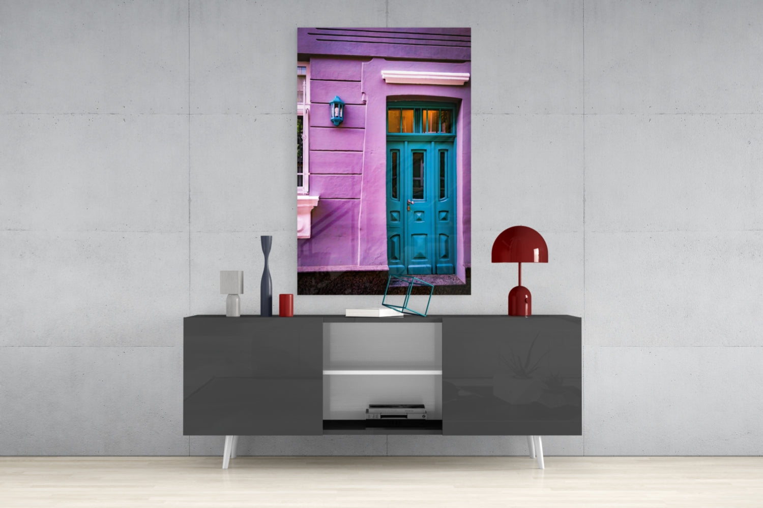 Purple House Glass Wall Art displayed above gray console table with white legs, featuring blue door and pink facade.