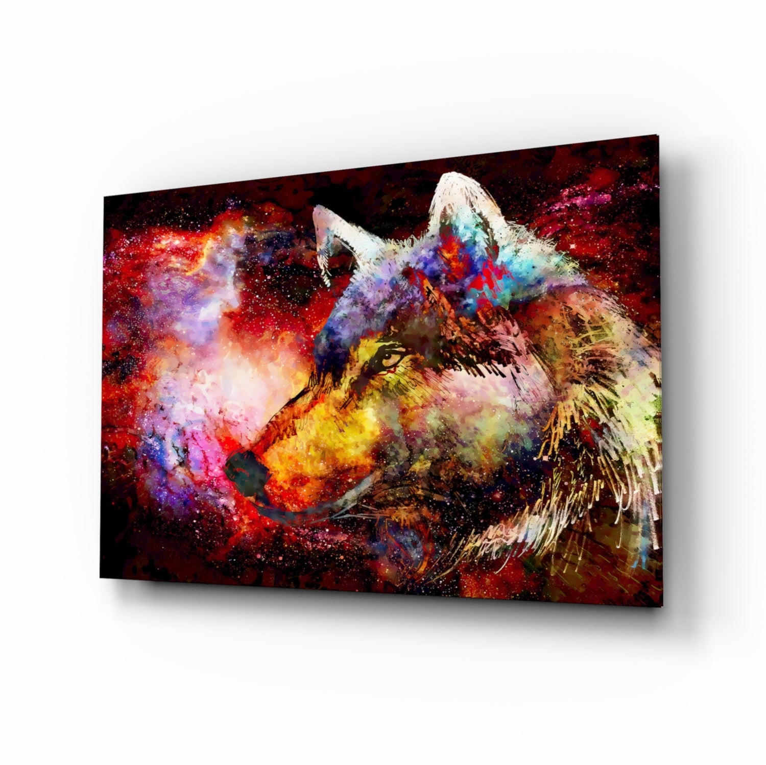 Angled view of a glass wall art panel displaying a colorful wolf's head with vibrant red, purple, blue, and yellow paint splatters against a dark background.