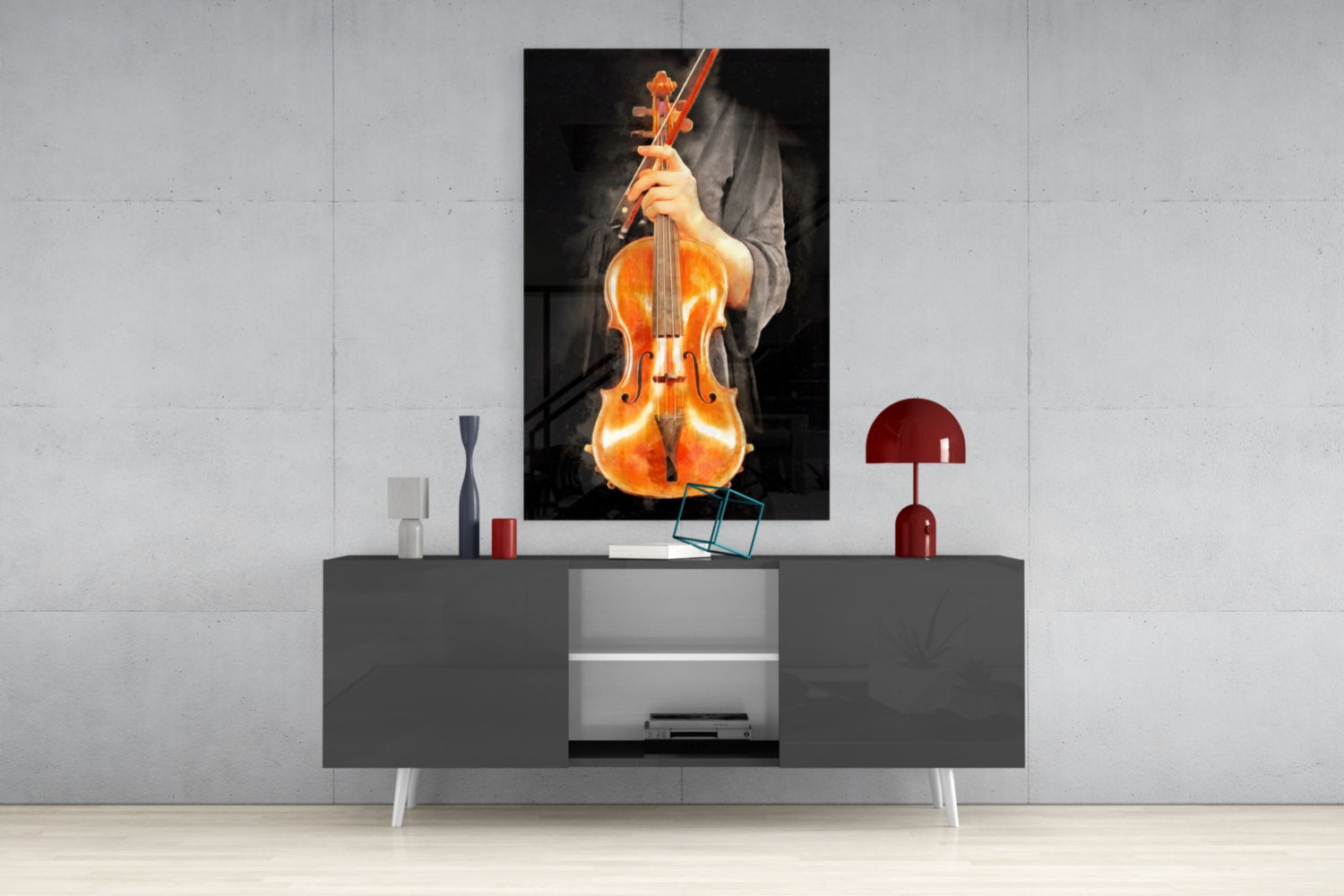 Violin glass wall art depicting a glowing amber violin with bow displayed above a gray media console in a modern interior setting.