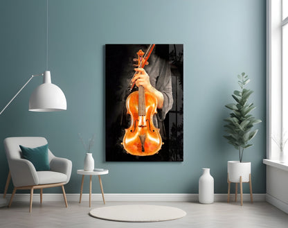 Glowing golden-orange violin held by hands against dark background, displayed on teal wall in modern living room setting.