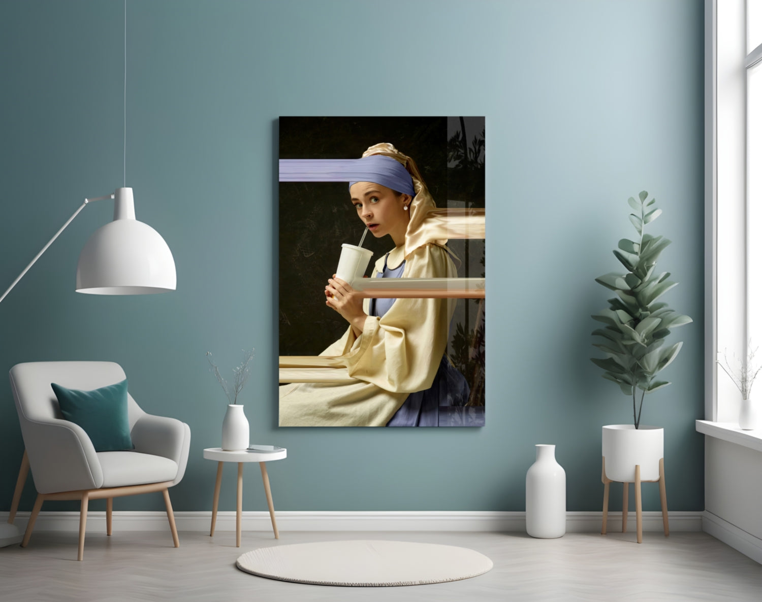 Glass art print of Girl with a Pearl Earring mounted on turquoise wall in modern living room setting with white furniture.