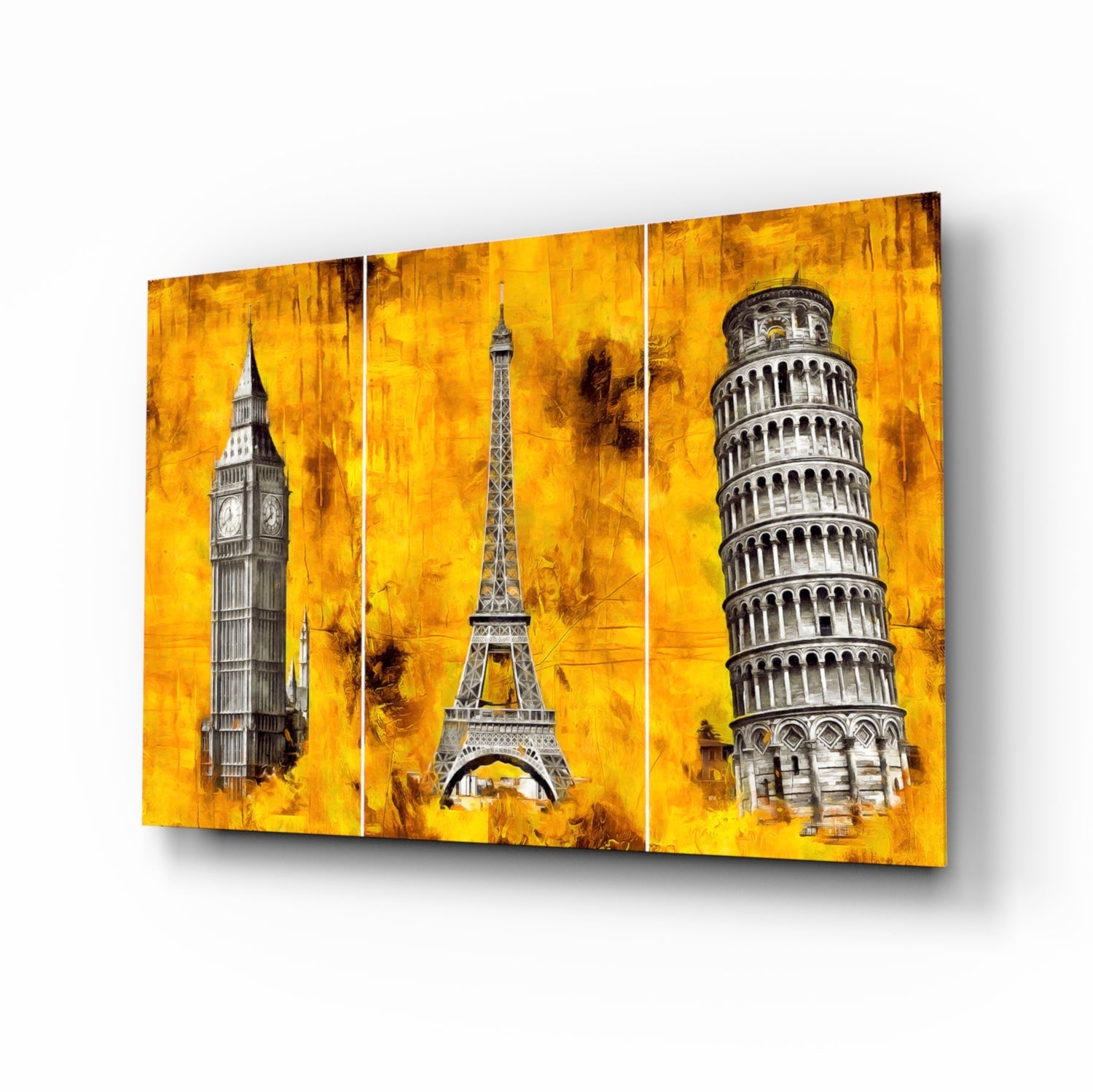 Three-panel glass wall art featuring Big Ben, Eiffel Tower, and Leaning Tower of Pisa against a textured golden yellow background, displayed at an angle.
