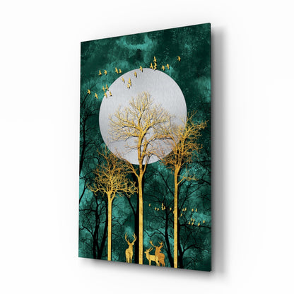Angled view of teal glass wall art featuring gold trees, deer, flying birds, and a white moon against dark green background.