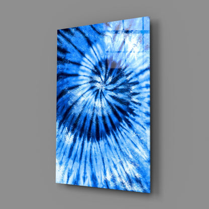 Blue mosaic glass wall art displayed at an angle, showing a radial starburst pattern in shades of blue and white.