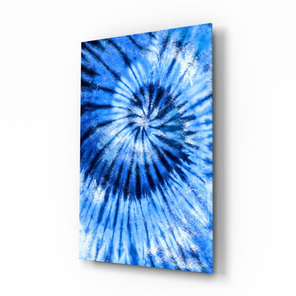 Blue mosaic glass wall art panel displaying radial sunburst pattern with white and navy streaks on angled display.