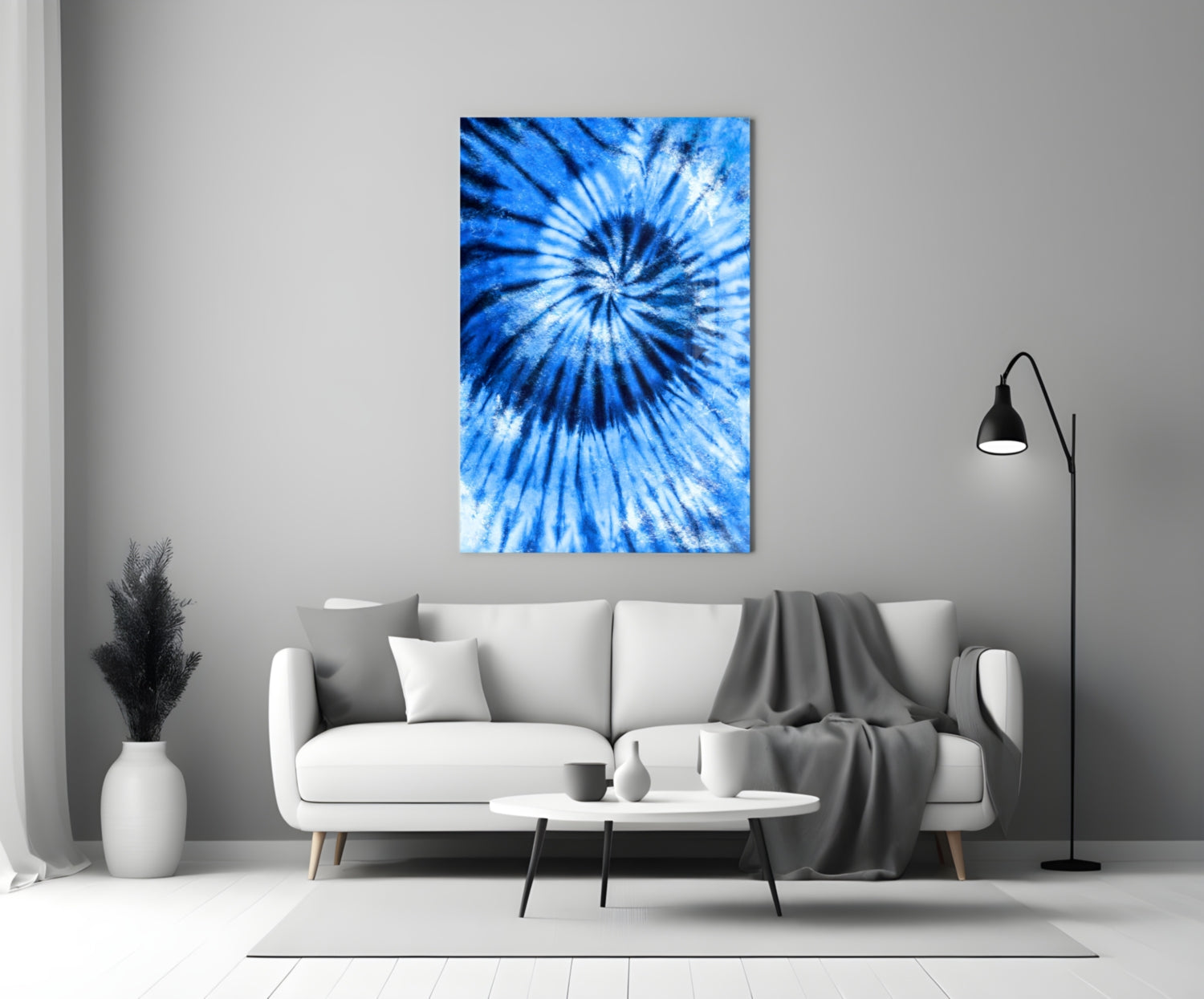 Blue mosaic glass wall art with radial tie-dye pattern displayed above white sofa in modern living room.