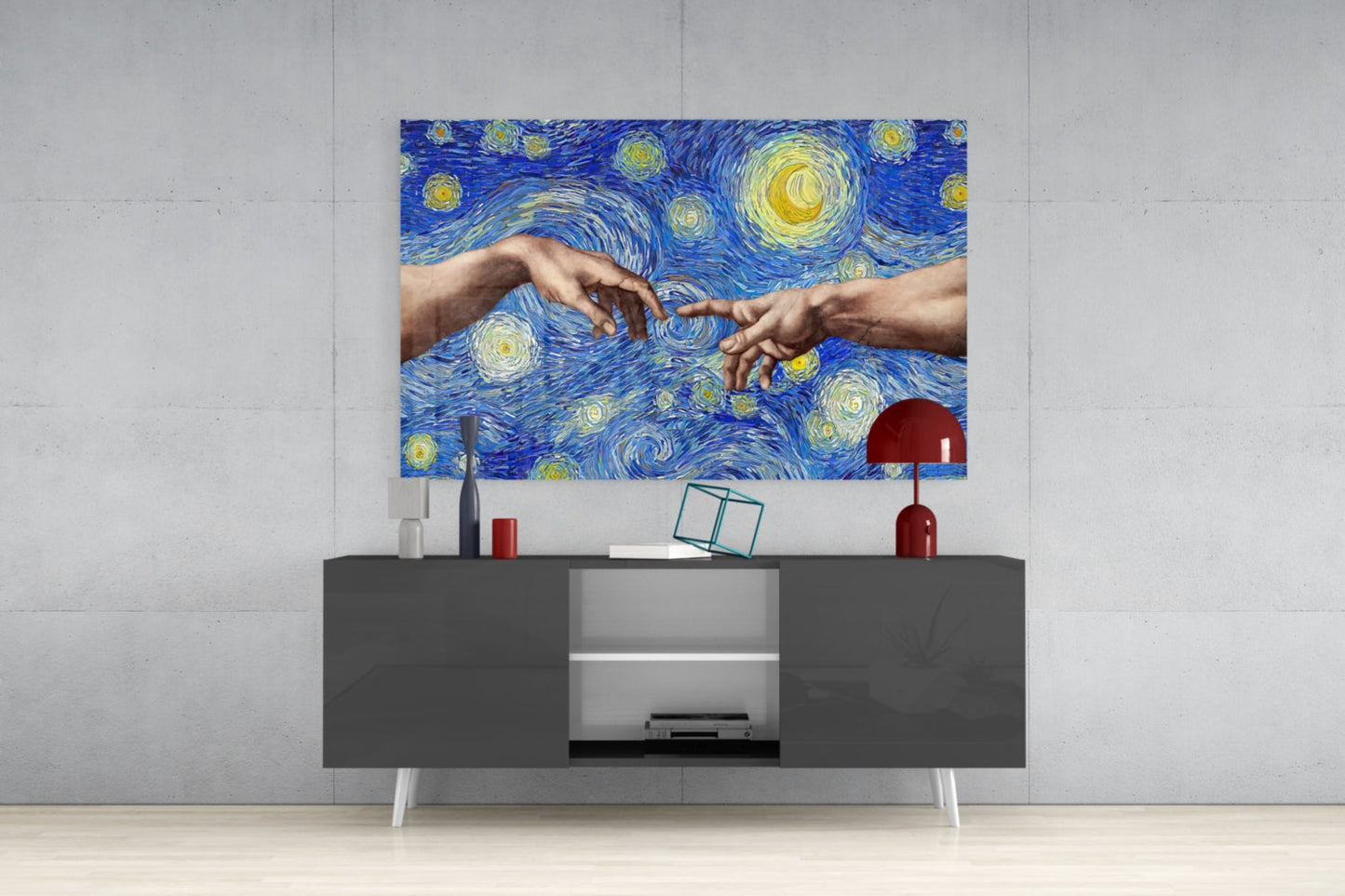 Modern living room with glass wall art depicting two hands touching against a blue starry background displayed above a dark gray media console.
