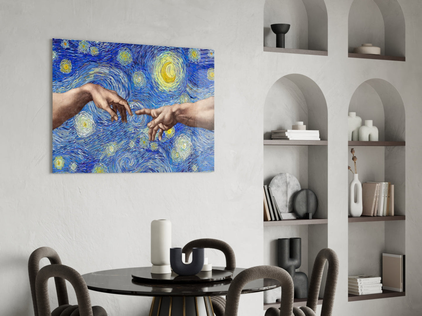 Blue and yellow starry night glass wall art with two hands touching, displayed above a round black dining table with gray chairs in a modern interior.