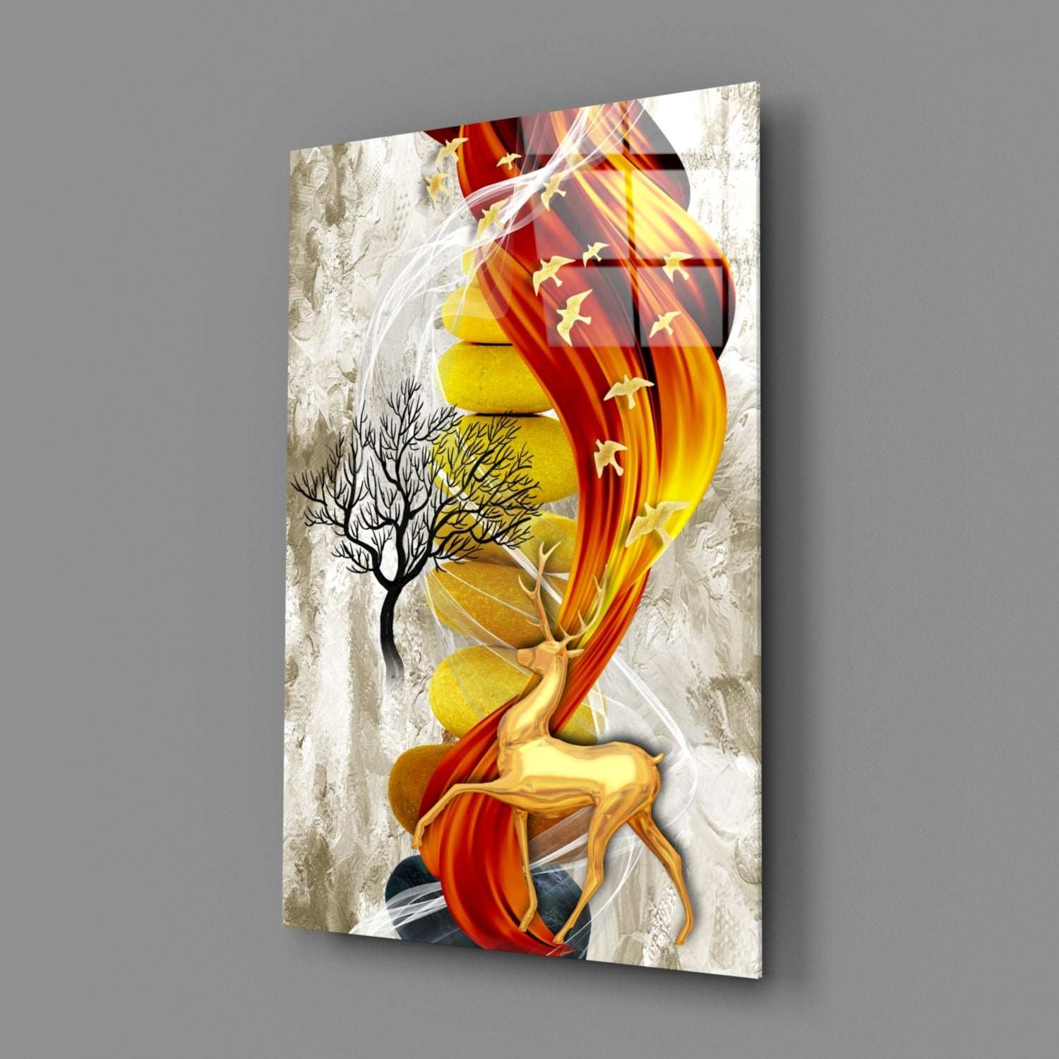 Abstract glass wall art depicting a golden deer with red and yellow flowing fabric, bare tree, and textured white background, displayed at an angle.