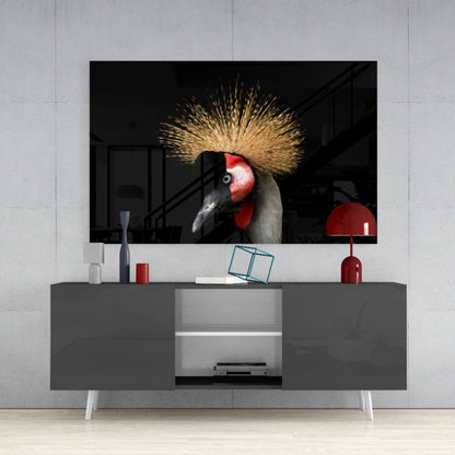 Crane bird glass wall art mounted above gray media console, displaying red-headed crane with golden crest plumage against black background.