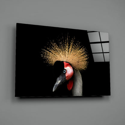 Glass wall art panel displaying a crowned crane in profile against black background, with golden crest and red facial markings visible.
