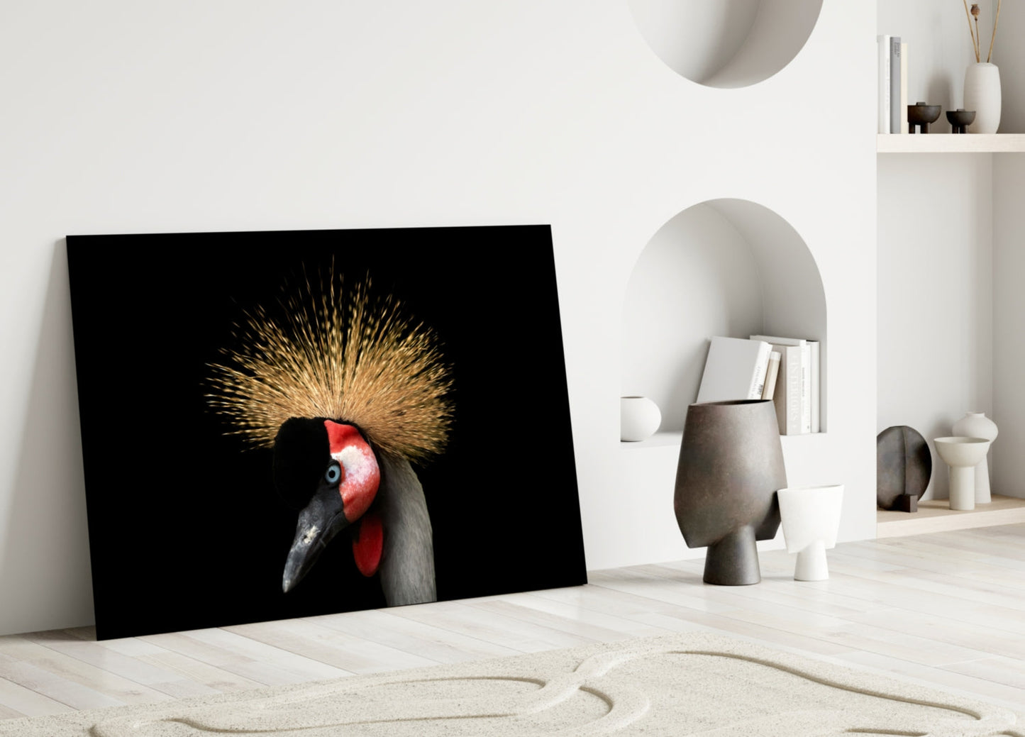 Black glass wall art featuring a crowned crane with golden crest and red face against dark background, leaning against white wall.