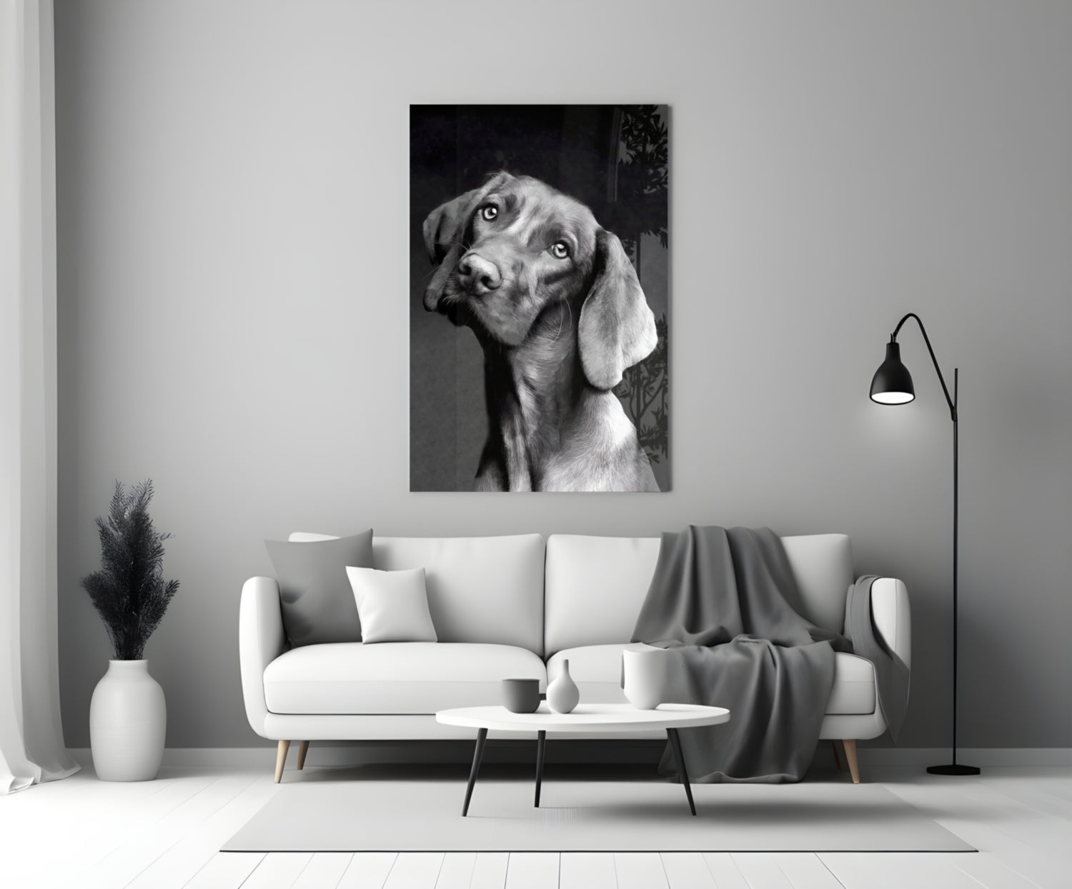 Black and white dog portrait glass wall art displayed above a white sofa in a modern living room setting.