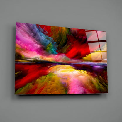 Colorful glass wall art panel displaying vibrant magenta, red, yellow, and blue swirling landscape composition mounted on gray wall.