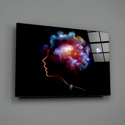 Glass wall art depicting a glowing red neon profile with a vibrant cosmic nebula burst emanating from the head, displayed at an angle against gray background.