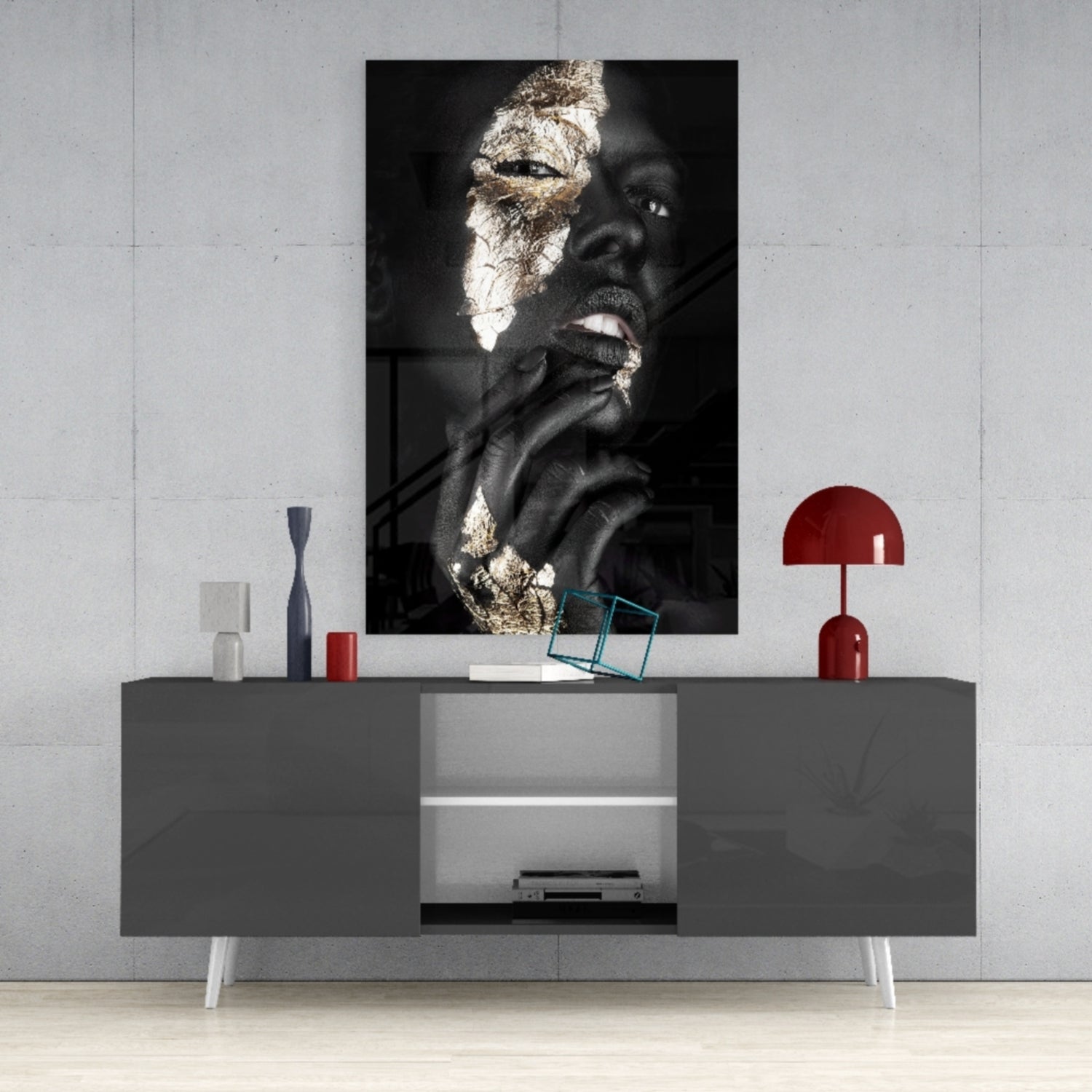 Modern living room with gray media console displaying gold-leafed portrait artwork mounted on white wall above.