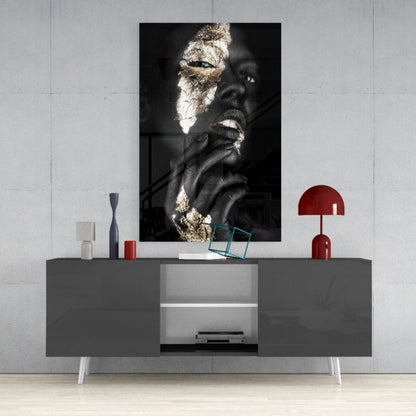 Modern living room with gray media console displaying gold-leafed portrait artwork mounted on white wall above.