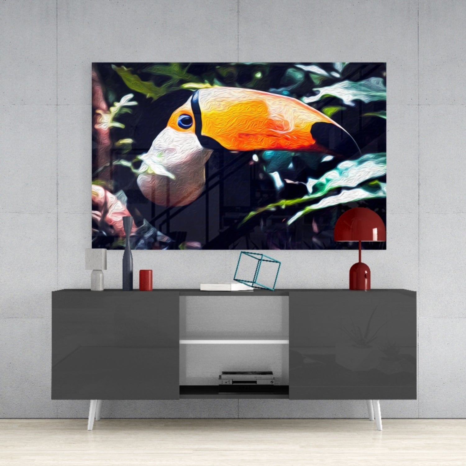 Toco Toucan glass wall art displayed above a gray media console, showing the bird's orange beak and white chest against dark foliage.