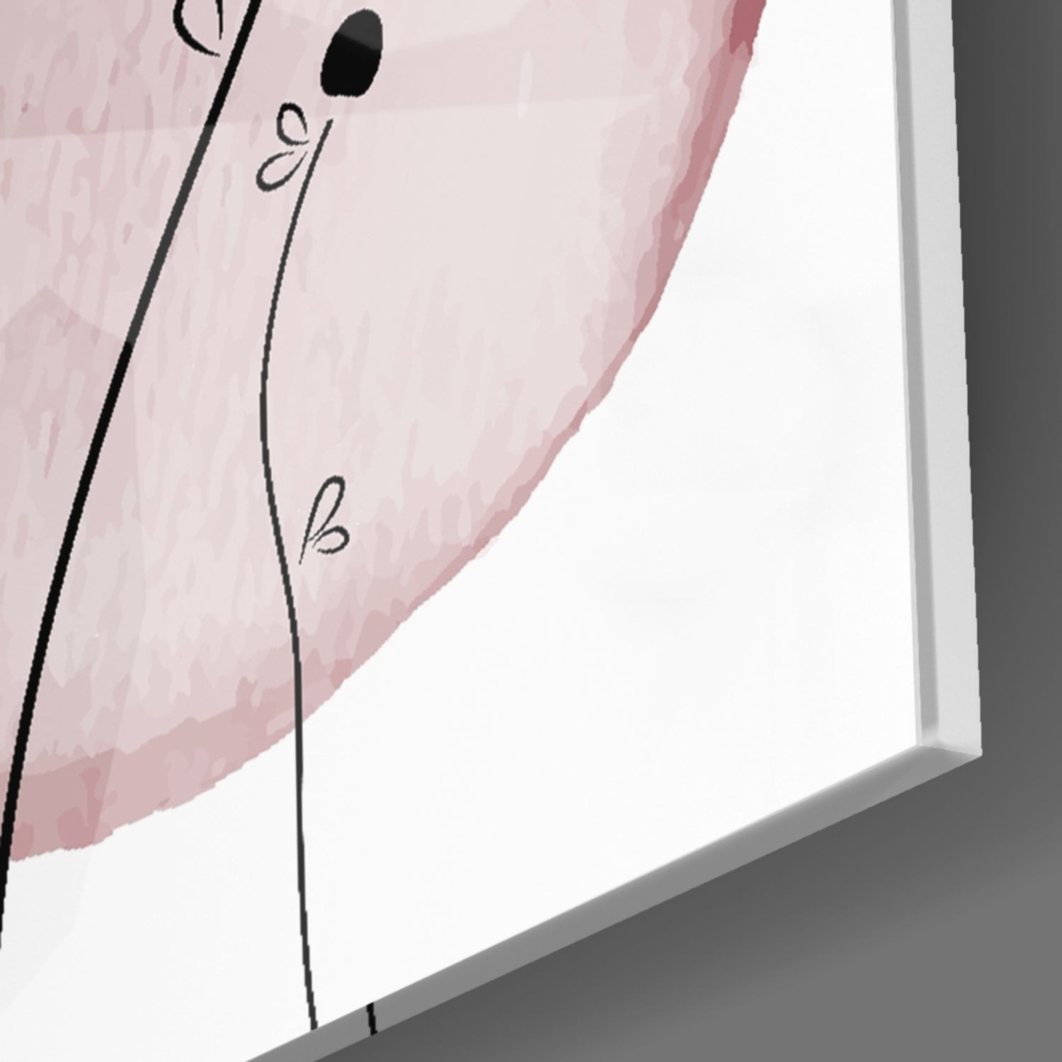 Close-up angled view of pink glass wall art with black line drawings and handwritten letters a, b, c visible on the surface.