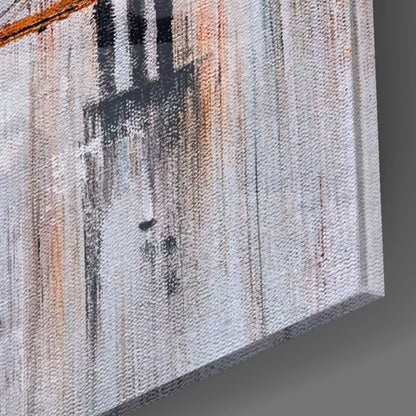 Close-up side angle of textured canvas wall art showing vertical brushstrokes in black, tan, and cream tones.