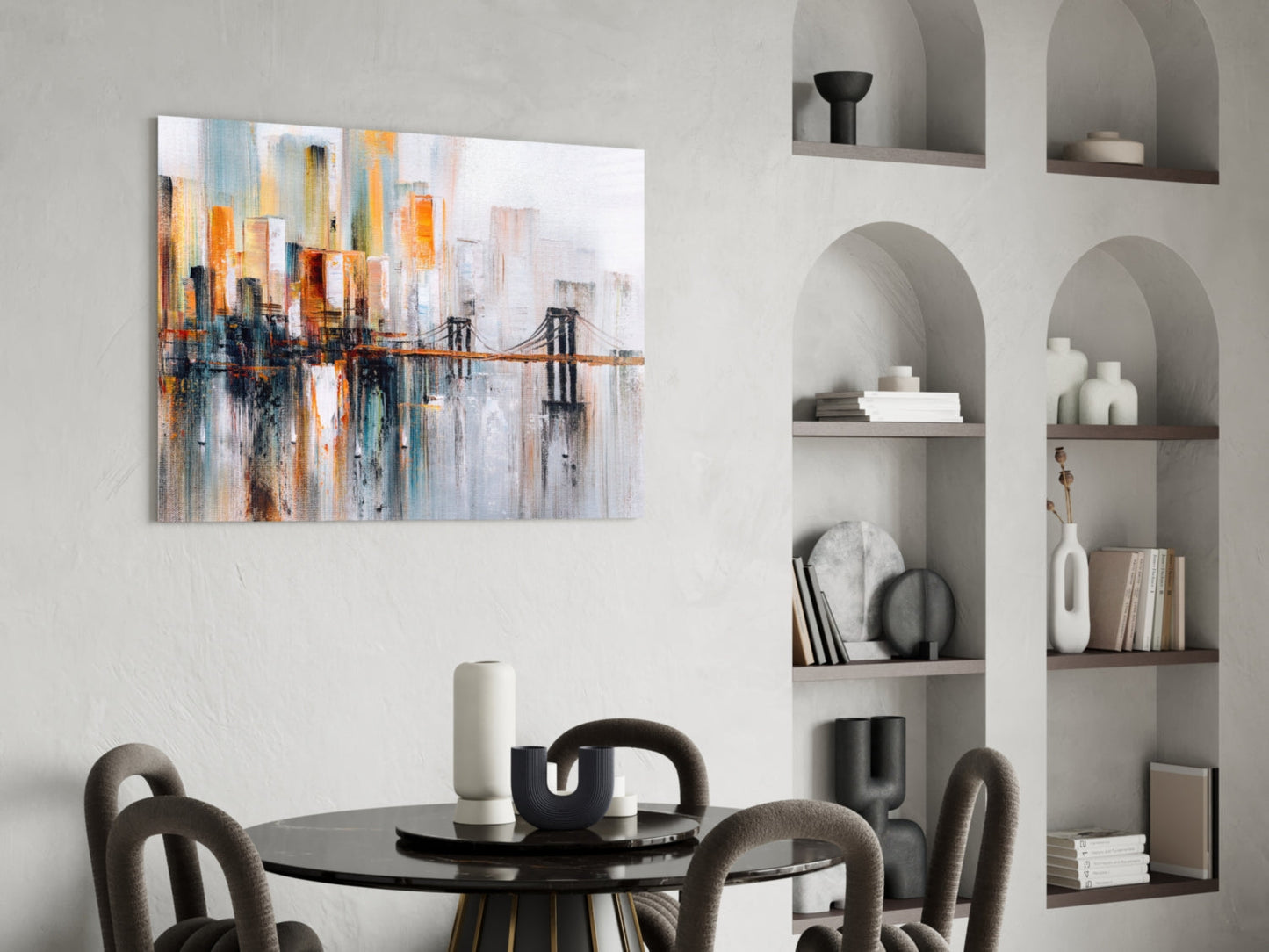 Abstract cityscape glass wall art featuring orange, blue, and white tones with bridge motif, displayed above black dining table in modern interior.